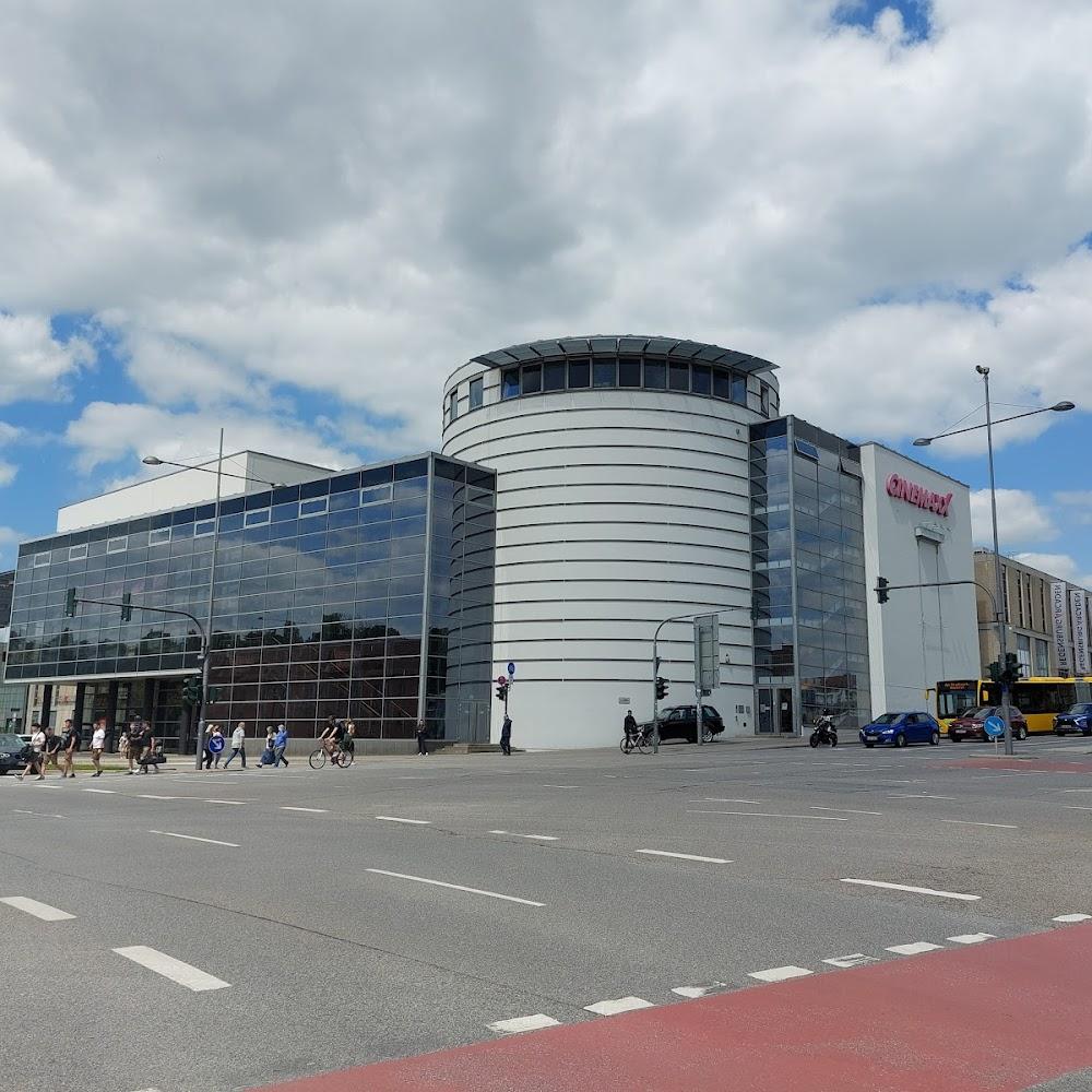 A white and glass building with the sign